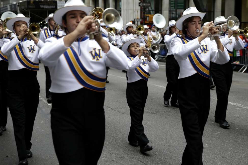 FILE - In this Oct. 13, 2014, file photo, a marching band participates in the Columbus Day parade in New York. A movement to abolish Columbus Day and replace it with Indigenous Peoples Day has new momentum but the gesture to recognize victims of European colonialism has also prompted howls of outrage from some Italian Americans, who say eliminating their festival of ethnic pride is culturally insensitive, too. (AP Photo/Seth Wenig, File)