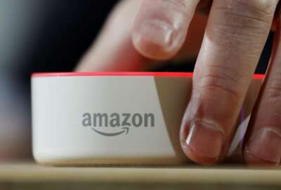 FILE - In this Wednesday, Sept. 27, 2017, file photo, an Amazon Echo Dot is displayed during a program announcing several new Amazon products by the company, in Seattle. Amazon.com, Inc. reports earnings Thursday, Oct. 26, 2017. (AP Photo/Elaine Thompson, File)