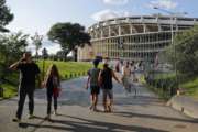 FILE - In this Aug. 5, 2017, file photo, people make their way to RFK Stadium in Washington before the start of an MLS soccer match between D.C. United and Toronto FC.  D.C. United will play their final game at RFK Stadium on Sunday. The United have already been eliminated from the playoffs, but they hope to say goodbye to the historic venue with a victory over the Red Bulls. (AP Photo/Pablo Martinez Monsivais, File)