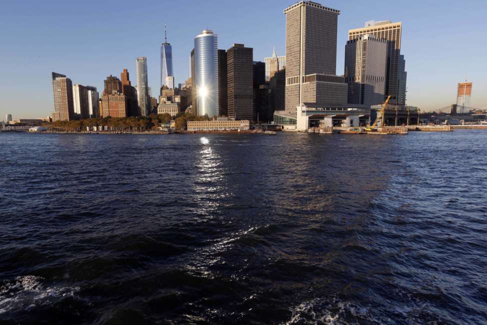 Water from New York Harbor surrounds the southern tip of New York's Manhattan borough on Tuesday, Oct. 17, 2017, seen from aboard a Staten Island Ferry. Superstorm Sandy roared ashore five years ago, Monday, Oct. 29, 2012, devastating the coastlines of New Jersey, New York and parts of Connecticut and becoming one of the costliest storms in U.S. history. (AP Photo/Seth Wenig)