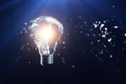 Exploding light bulb on a blue background, with concept creative thinking and innovative solutions. 3D rendering