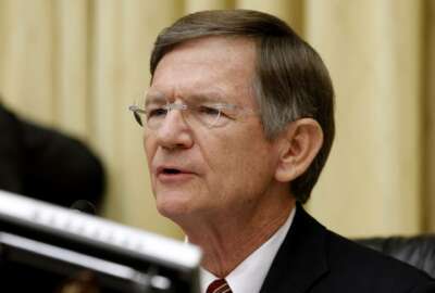FILE - In this June 7, 2012 file photo, House Science Committee Chairman Rep. Lamar Smith, R-Texas speaks on Capitol Hill in Washington. He is one of four veteran Texas Republicans who are quitting Congress, meaning their state will be trading House seniority for newcomers who may be even more conservative.(AP Photo/Charles Dharapak, File)
