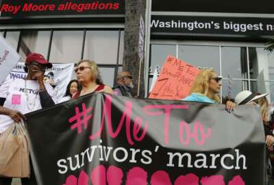 FILE - In this Nov. 12, 2017, file photo, participants rally outside CNN's Hollywood studios on Sunset Boulevard to take a stand against sexual assault and harassment for the #MeToo March in the Hollywood district of Los Angeles. A spate of recent public revelations, including the spontaneous #metoo discussions on social media, is emboldening many victims of sexual harassment to speak up, but many still remain silent. (AP Photo/Damian Dovarganes, File)