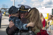 A U.S. Sailor reunites with his family at Naval Station San Diego, Calif., Oct. 29, 2013, after returning from a seven-month deployment aboard the guided missile cruiser USS Princeton (CG 59). The Princeton conducted maritime security operations, theater security cooperation efforts and support missions for Operation Enduring Freedom in the U.S. 5th Fleet and U.S. 7th Fleet areas of responsibility. 