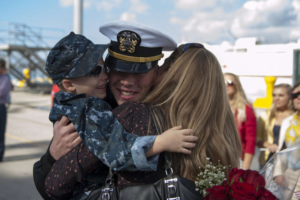 A U.S. Sailor reunites with his family at Naval Station San Diego, Calif., Oct. 29, 2013, after returning from a seven-month deployment aboard the guided missile cruiser USS Princeton (CG 59). The Princeton conducted maritime security operations, theater security cooperation efforts and support missions for Operation Enduring Freedom in the U.S. 5th Fleet and U.S. 7th Fleet areas of responsibility. 