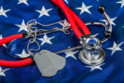 Blank Dog Tags and Stethoscope on American Flag