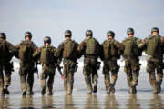 Crewman Qualification Training students hitting the surf before the start of medical training instru