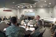 Secretary of the Army John McHugh receives an update briefing from various staff members of U.S. Army Cyber Command during a visit April 2, 2012, Fort Belvoir, Va. U.S. Army Cyber Command is the newest Army Service Component Command. (U.S. Army photo by Spc. John G. Martinez) (Photo Credit: Spc. John G. Martinez)