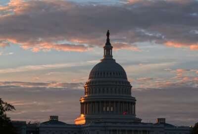 FILE - In this June 20, 2017, file photo, the U.S. Capitol in Washington, at sunrise. There’ll be two new faces in the Senate and plenty of familiar but stubborn problems facing Congress in 2018, starting with a Jan. 19 deadline to reach a bipartisan budget pact and avert a partial government shutdown (AP Photo/J. Scott Applewhite, File)