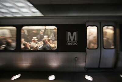 A Metro train departs the Gallery Place-Chinatown Metro Station, Thursday, Jan. 11, 2018, in Washington. Washington's Metro system has become internationally synonymous with delays, breakdowns and smoke-filled tunnels. (AP Photo/Alex Brandon)