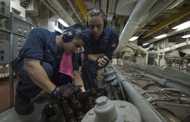 PACIFIC OCEAN (June 29, 2013) Engineman 2nd Class Jeffrey Le, left, and Fireman Elizabeth Lafferty conduct maintenance aboard the amphibious dock landing ship USS Pearl Harbor (LSD 52). Pearl Harbor, underway for Pacific Partnership 2013, is en route to the Republic of the Marshall Islands. 