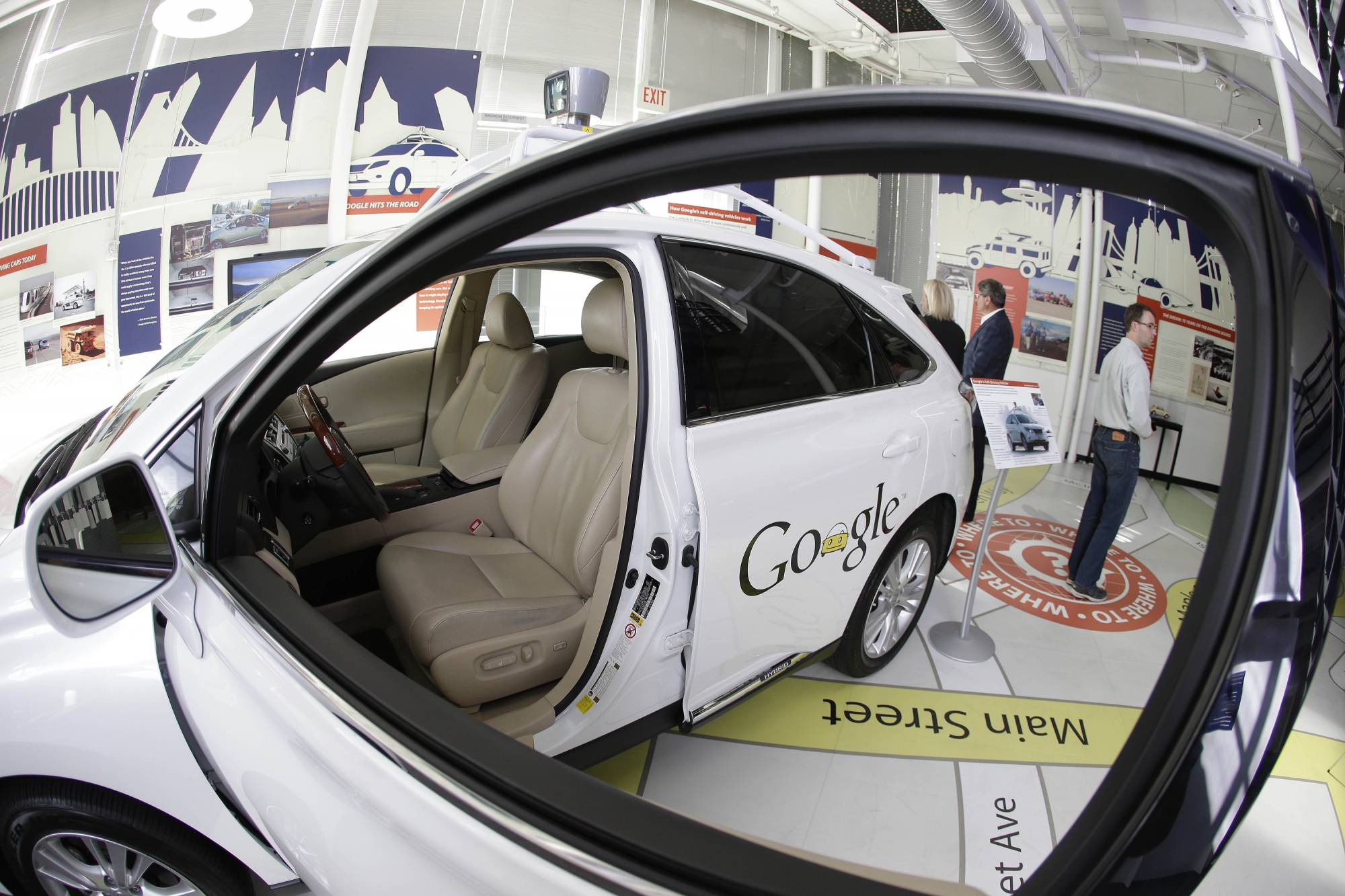 FILE - In this photo Wednesday, May 14, 2014 file photo, a Google self-driving car is on exhibit at the Computer History Museum in Mountain View, Calif. Driverless cars will be tested on California roads for the first time without a human being behind a steering wheel under new rules for the fast-developing technology. The regulations approved Monday, Feb. 26, 2018, are a major step toward getting autonomous vehicles onto the streets of California, the nation's self-driving car hub. (AP Photo/Eric Risberg, File)