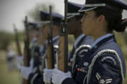 U.S. Air Force Airman 1st Class Twila Stone readies her weapon during a Memorial Day ceremony May 28, 2012, at the Texas State Veteran Cemetery in Abilene, Texas. Memorial Day is a day of remembering the men and women who died while serving in the United States Armed Forces. Stone is assigned to the 7th Logistics Readiness Squadron.