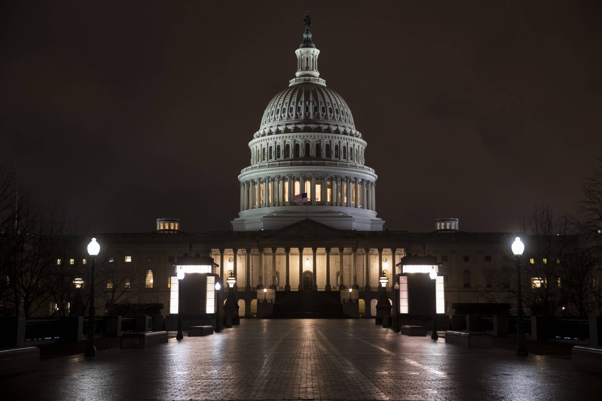 The Capitol is seen before dawn Wednesday after a night of negotiating on the government spending bill, in Washington, March 21, 2018. Talks over a $1.3 trillion omnibus bill are almost complete as the White House and Capitol Hill Democrats ironed out deals on a first round of funding for President Donald Trump's U.S.-Mexico border wall. (AP Photo/J. Scott Applewhite)