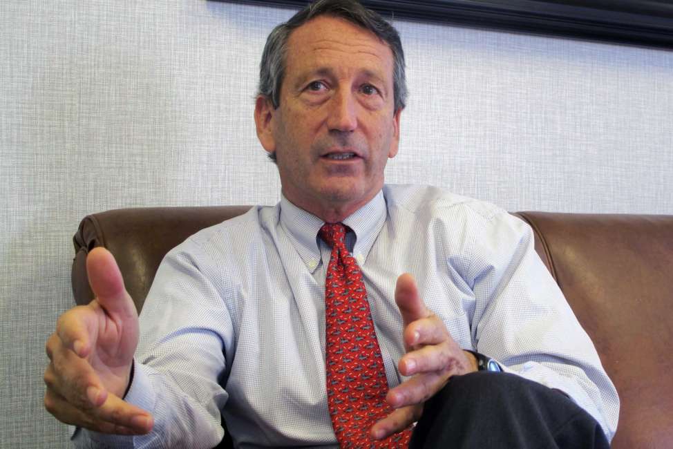 FILE - In this  Dec. 18, 2013 file photo, U.S. Rep. Mark Sanford, R-S.C., discusses his first months back in Congress during an Associated Press interview in his district office in Mount Pleasant, S.C. Sanford said on Friday, Sept. 12, 2014, that he and his fiancee are calling off their engagement due to the ongoing contention with his ex-wife Jenny Sanford, four years after their divorce. (AP Photo/Bruce Smith, File)