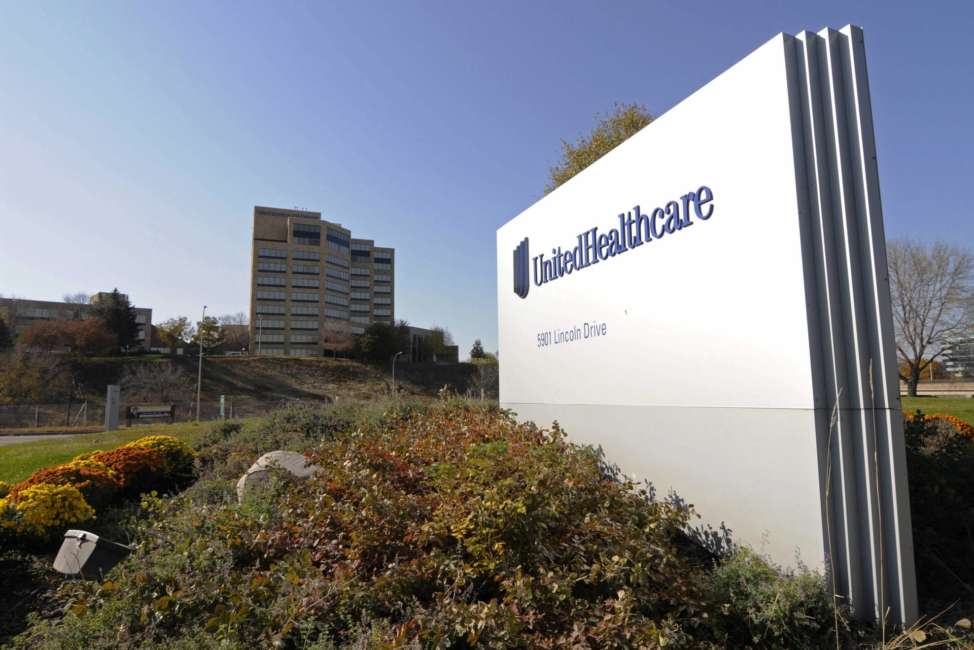 FILE - This Oct. 16, 2012, file photo, shows a portion of the UnitedHealth Group Inc.'s campus in Minnetonka, Minn. The nation's largest health insurer plans to give some customers a break at the pharmacy counter starting next year. UnitedHelathcare said Tuesday, March 6, 2018, that it will pass along rebates from drug manufacturers to customers when they fill a prescription. Those rebates could amount to a few bucks or several hundred dollars, depending on the drug. (AP Photo/Jim Mone, File)