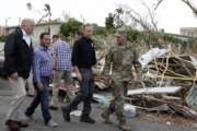 FILE - In this Oct. 3, 2017 file photo, President Donald Trump walks with FEMA administrator Brock Long, second from right, and Lt. Gen. Jeff Buchanan, right, during a tour of an area affected by Hurricane Maria in Guaynabo, Puerto Rico. Puerto Rican officials say the Trump administration is neglecting the territory because it doesn't have votes in Congress or presidential elections. The Trump administration has blamed Puerto Rico for creating delays in the disbursement process, but has not been more specific. (AP Photo/Evan Vucci, File)