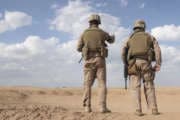 Al Taqaddum, Iraq, April 3, 2007 - Marines scan the horizon for insurgent activity during a security patrol April 3. The Marines of Military Police Company conducted the patrol to ensure the safety of 2nd Marines Logistics Group assets in the area.