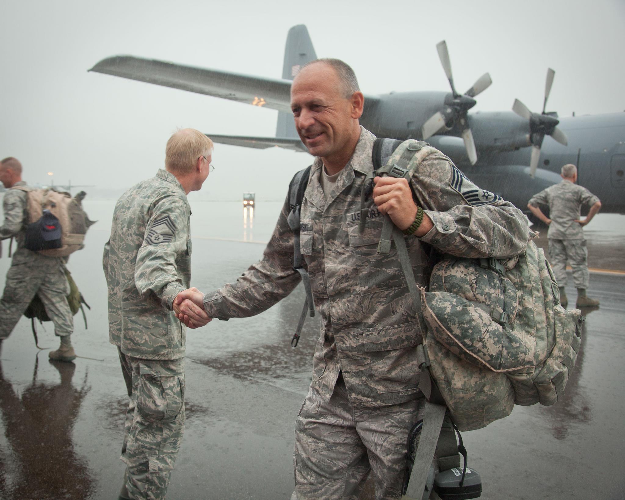 Even the rain cannot stop friends and families from reuniting with Airmen of the 934th Airlift Wing as they return from overseas. The Airmen have been deployed since early 2012 from the Minneapolis-St. Paul International Airport Air Reserve Station, Minn. (Shannon McKay)