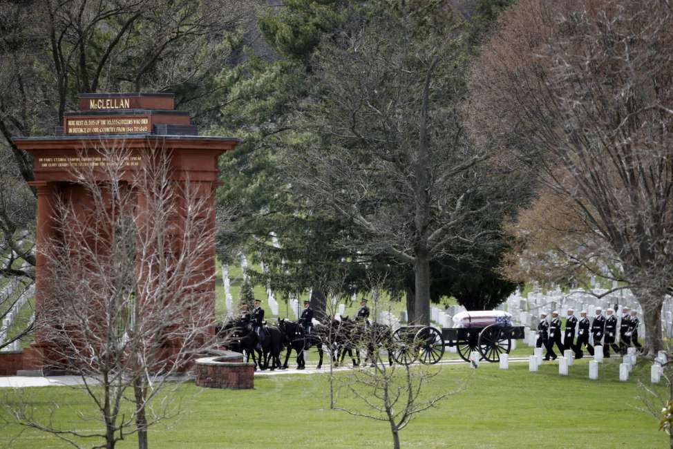 A horse drawn caisson arrives through the McClellan Gate for burial services for Capt. Thomas J. Hudner Jr., a naval aviator and Medal of Honor recipient from Concord, Mass., at Arlington National Cemetery Wednesday, April 4, 2018 in Arlington, Va. Hudner earned the Medal of Honor for his actions in the Battle of the Chosin Reservoir during the Korean War.(AP Photo/Alex Brandon)