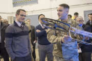 Sgt. 1st Class Daniel Guenther, right, of the U.S. Army Research Laboratory, explains the Joint Tactical Aerial Resupply Vehicle concept to then-Strategic Capabilities Office Director William Roper, left, using a small-scale model at Aberdeen Proving Ground in Maryland on Jan. 10, 2017. 