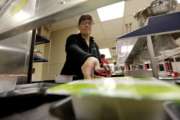 A kitchen server places breakfast out in an empty cafeteria at Kyrene De Las Lomas Elementary School Thursday, April 26, 2018, in Phoenix. Teachers in Arizona and Colorado walked out of their classes over low salaries keeping hundreds of thousands of students out of school. It's the latest in a series of strikes across the nation over low teacher pay. (AP Photo/Matt York)