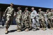 Arizona National Guard soldiers line up as they get ready for a visit from Arizona Gov. Doug Ducey prior their deployment to the Mexico border at the Papago Park Military Reservation Monday, April 9, 2018, in Phoenix. (AP Photo/Ross D. Franklin)