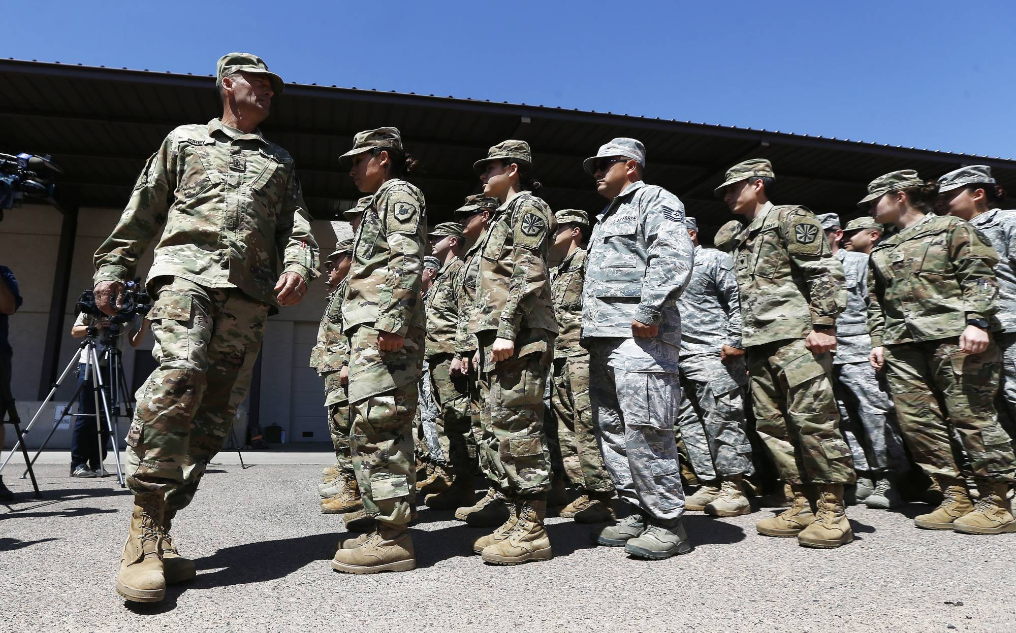 Arizona National Guard soldiers line up as they get ready for a visit from Arizona Gov. Doug Ducey prior their deployment to the Mexico border at the Papago Park Military Reservation Monday, April 9, 2018, in Phoenix. (AP Photo/Ross D. Franklin)