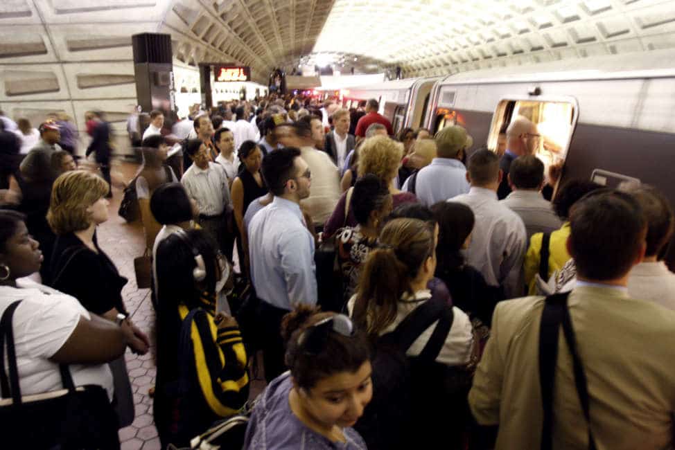 A large crowd of commuters await a red line train at the Metro Center Station in Washington, Thursday, June 25, 2009, as service through to Glenmont resumed this morning following Monday's wreck. (AP Photo/Harry Hamburg)