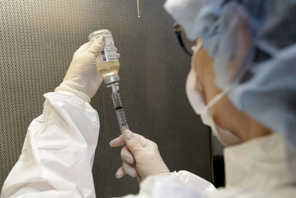 FILE- In this Jan. 8, 2018, file photo, a certified pharmacy technician fills a syringe for use in an I.V. at a hospital in Toledo, Ohio. The healthiest pay packages go to CEOs at health care companies. For the second time in three years, chief executives in the health care field led the S&amp;P 500 in terms of total compensation. (AP Photo/Tony Dejak, File)