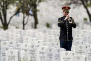 A lone Army bugler plays taps during an interment at Arlington National Cemetery, our nation’s most hallowed ground