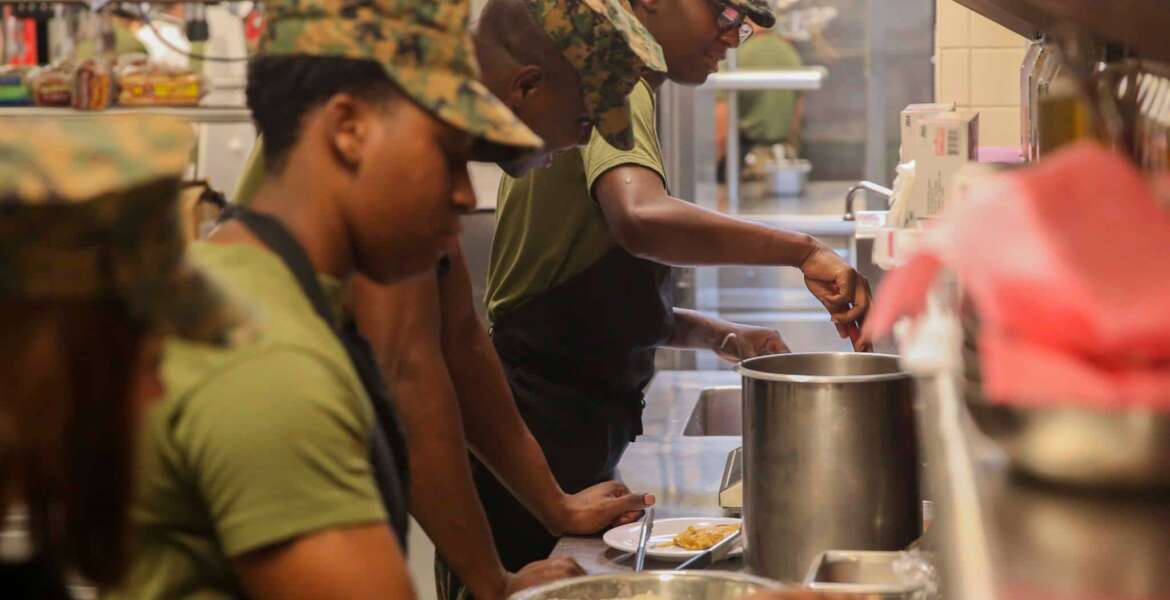 Lance Cpl. Lydia Gulley, a Marine with Marine Wing Support Squadron 271, applies the skills taught about cooking quickly at Mess Hall 128 on Marine Corps Base Camp Lejeune, Sept. 22. The Sodexo Company Quality of Life Services teaches methods to Marine food service specialist to improve the basic services to include stir fry cooking, steaming, boiling, sautéing, roasting, braising, stewing and knife skills. (U.S. Marine Corps photo by Lance Cpl. Tavarius Hernandez)