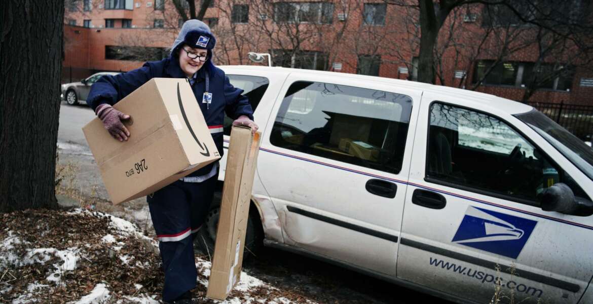 FILE- In this Dec. 24, 2017, file photo, United States Postal Service worker Missie Kittok, who has been a letter carrier for 15 months, helps deliver some packages in time for Christmas in Minneapolis, Amazon’s Prime shipping program set the pace for shoppers’ expectations, and the nation’s largest online player continues to look for new ways to keep up with shoppers’ demands. That’s forcing other companies to radically think of new initiatives to get products to shoppers’ doors faster. (Richard Tsong-Taatarii/Star Tribune via AP, File)