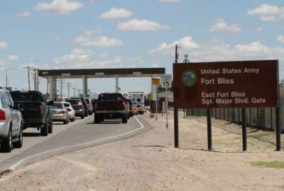 FILE - In this Sept. 9, 2014, file photo, cars wait to enter Fort Bliss in El Paso, Texas. The U.S. Department of Homeland Security has formally requested space for up to 12,000 beds at a military base to detain families caught crossing the border illegally, two Trump administration officials said Wednesday, June 27, 2018. The facility will be housed at a military base, but it's not clear yet which one. Defense Secretary Jim Mattis said that two bases had been identified to house migrants: Goodfellow Air Force Base near San Angelo, Texas, and Fort Bliss.  (AP Photo/Juan Carlos Llorca, File)