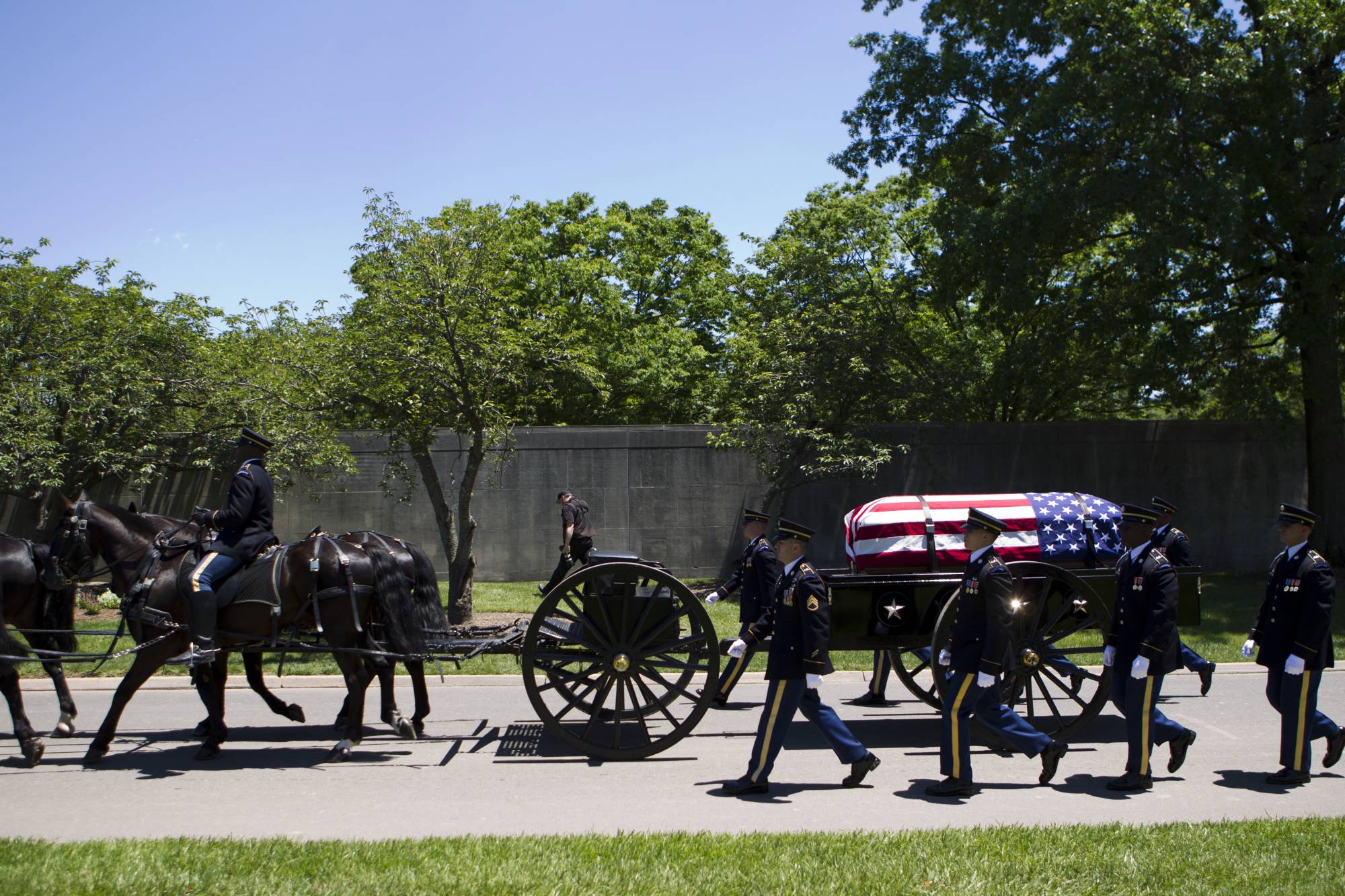A caisson carries the casket of U.S. Army Air Forces 2nd Lt. Robert R. Keown to the burial site at Arlington National Cemetery in Arlington, Va., on Friday, June 15, 2018. Keown was piloting his P-38 aircraft when it crashed in Papua New Guinea in 1944. (AP Photo/Jose Luis Magana)