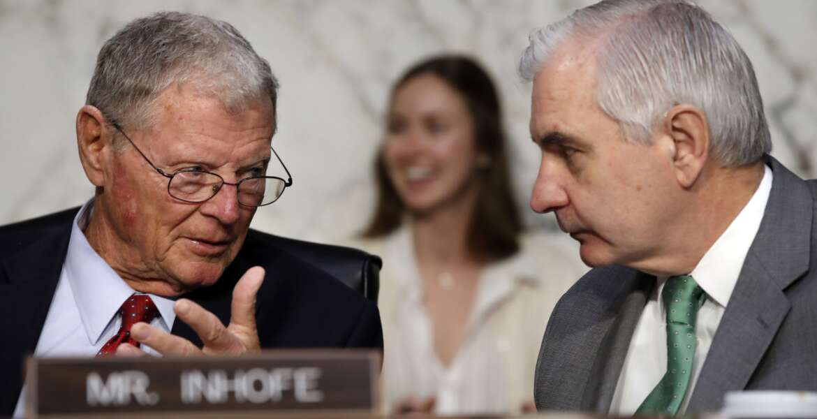 Sen. Jim Inhofe, R-Okla., left, speaks with Senate Armed Services Committee Ranking Member Sen. Jack Reed, D-R.I., during a committee hearing with Defense Secretary Jim Mattis on the Department of Defense budget posture, Thursday April 26, 2018, on Capitol Hill in Washington. 