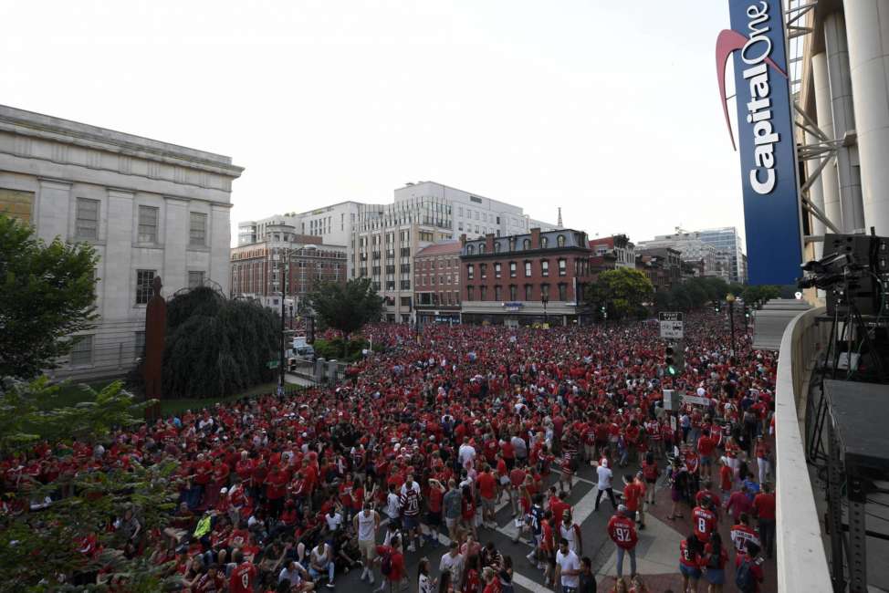 Fans gather outside Capital One Arena at a viewing party for Game 5 of the NHL hockey Stanley Cup Final between the Washington Capitals and the Vegas Golden Knights, Thursday, June 7, 2018, in Washington. (AP Photo/Nick Wass)