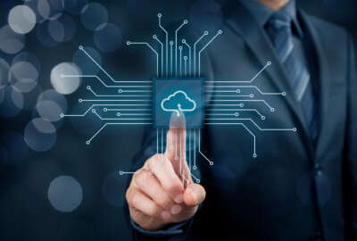 Cloud computing concept - connect devices to cloud. Businessman or information technologist with cloud computing icon.
