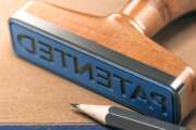 3D illustration of rubber stamp with the text patented. IP law and intellectual property patent concept