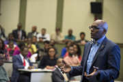 Group shot of Anthony Smith speaking with students