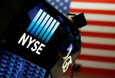 FILE - In this Dec. 27, 2017, file photo, a logo for the New York Stock Exchange is displayed above the trading floor. The U.S. stock market opens at 9:30 a.m. EDT on Thursday, July 5, 2018. (AP Photo/Mark Lennihan, File)