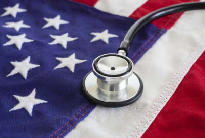 Healthcare reform concept with stethoscope and USA flag.