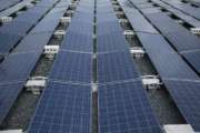 In this July 20 photo, solar panels installed by Tesla, power a community of 12 homes in the mountain town of Las Piedras, Puerto Rico. The homes still do not have power from the national grid, more than 10 months after Hurricane Maria and now is operating exclusively on solar energy. (AP Photo/ Dennis M. Rivera Pichardo)