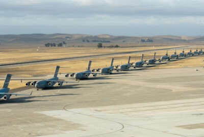 Seven U.S. Air Force C-17 Globemaster III aircraft, 11 KC-10 Extender aircraft and four C-5 Galaxy aircraft assigned to the 60th Air Mobility Wing line up at Travis Air Force Base, Calif., Sept. 11, 2013, for the Freedom Launch honoring the victims of the 9/11 terrorist attacks. The first plane departed at 8:46 a.m., the same time terrorists crashed American Airlines Flight 11 into the North Tower of the World Trade Center, with the remaining 21 aircraft launching consecutively during a 36-minute time frame. Terrorists hijacked four passenger aircraft Sept. 11, 2001. Two of the aircraft were deliberately crashed into the World Trade Center in New York; one was crashed into the Pentagon; the fourth crashed near Shanksville, Pa. Nearly 3,000 people died in the attacks. (U.S. Air Force photo by Heide Couch/Released)