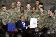 President Donald Trump signs the John McCain National Defense Authorization Act for the Fiscal Year 2019, during a signing ceremony Monday, Aug. 13, 2018, in Fort Drum, N.Y. (AP Photo/Hans Pennink)