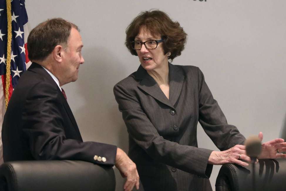 Utah Gov. Gary Herbert and Susan Combs, Interior Department's acting assistant secretary for policy, management and budget, talk before a roundtable discussion at the Ogden-Weber Chamber of Commerce in Ogden, Utah, on Tuesday, Aug. 28, 2018. (Kristin Murphy/The Deseret News via AP)