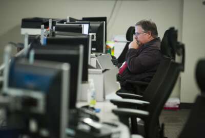 A workers sits a computer at the Department of Homeland Security's National Cybersecurity and Communications Integration Center (NCCIC) in Arlington, Va., Wednesday, Aug. 22, 2018. The center serves as the hub for the federal government's cyber situational awareness, incident response, and management center for any malicious cyber activity. (AP Photo/Cliff Owen)
