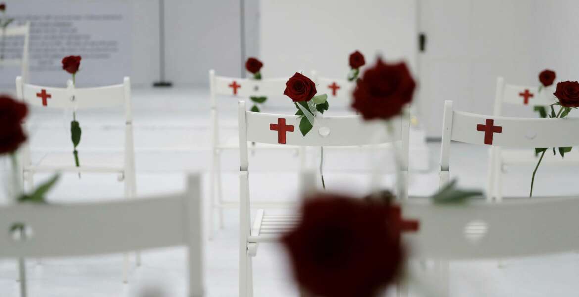 FILE - In this Nov. 12, 2017, file photo, a memorial for the victims of the shooting at Sutherland Springs First Baptist Church, including 26 white chairs each painted with a cross and and rose, is displayed in the church in Sutherland Springs, Texas. Republican leaders in gun-friendly Texas are stamping down the prospects of 'red flag' laws that would let enforcement seize some firearms from people who are deemed dangerous to themselves or others. Gun control advocates hoped for an opening after mass shootings at the church and high school within 6 months of each other. (AP Photo/Eric Gay, File)