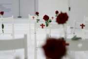 FILE - In this Nov. 12, 2017, file photo, a memorial for the victims of the shooting at Sutherland Springs First Baptist Church, including 26 white chairs each painted with a cross and and rose, is displayed in the church in Sutherland Springs, Texas. Republican leaders in gun-friendly Texas are stamping down the prospects of 'red flag' laws that would let enforcement seize some firearms from people who are deemed dangerous to themselves or others. Gun control advocates hoped for an opening after mass shootings at the church and high school within 6 months of each other. (AP Photo/Eric Gay, File)