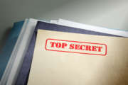 marked "top secret" on a pile of documents